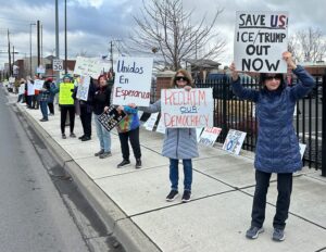 Protesters holding signs at Justice for ALL protest